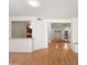 Open living space with views of the kitchen and an arched entrance to the foyer at 316 W Kelton Ln, Phoenix, AZ 85023