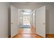 A peek at the open-concept living space through a set of double doors from adjacent room at 316 W Kelton Ln, Phoenix, AZ 85023