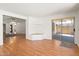 Bright living room with wood floors, a built-in nook and sliding glass doors to patio at 316 W Kelton Ln, Phoenix, AZ 85023