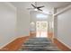 Spacious living room with wood flooring and a view of the backyard pool at 316 W Kelton Ln, Phoenix, AZ 85023