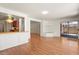 Spacious living room with a breakfast bar into the kitchen and sliding glass door to the backyard at 316 W Kelton Ln, Phoenix, AZ 85023