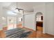 Bright, open living area with modern ceiling fan, light wood flooring and view into the kitchen at 316 W Kelton Ln, Phoenix, AZ 85023