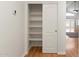 Well-organized pantry with white shelving and a sliding door for efficient storage and a clean look at 316 W Kelton Ln, Phoenix, AZ 85023