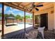 Covered patio with a view of the backyard oasis, perfect for relaxing and entertaining at 316 W Kelton Ln, Phoenix, AZ 85023