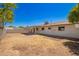 Wide view of the backyard showing a patio and perimeter fencing at 3209 N 20Th Pl, Phoenix, AZ 85016