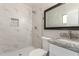 Bathroom with marble-look shower, granite vanity, and tile floors at 3209 N 20Th Pl, Phoenix, AZ 85016