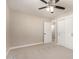 A bedroom with carpet, ceiling fan, white doors, and white closet at 3209 N 20Th Pl, Phoenix, AZ 85016