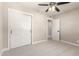 A bedroom with carpet, ceiling fan, one door, and a white closet at 3209 N 20Th Pl, Phoenix, AZ 85016