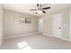 A bedroom with carpet, ceiling fan, one window, and white doors at 3209 N 20Th Pl, Phoenix, AZ 85016