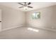 A bright bedroom with carpet, ceiling fan, and one window allowing natural light at 3209 N 20Th Pl, Phoenix, AZ 85016
