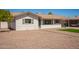 Attractive single-story home with fresh exterior paint, neat gravel landscaping, and mature trees at 3209 N 20Th Pl, Phoenix, AZ 85016