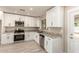 Modern kitchen featuring granite counters, stainless appliances, and clean white cabinetry at 3209 N 20Th Pl, Phoenix, AZ 85016