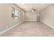 Inviting living room features updated flooring, a ceiling fan, and bright natural light from the large windows at 3209 N 20Th Pl, Phoenix, AZ 85016