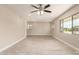 Open living room with tile floors, recessed lights, and plenty of natural light from multiple windows at 3209 N 20Th Pl, Phoenix, AZ 85016