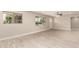 Spacious living area features tile flooring, neutral colors, updated ceiling fan, and windows for ample light at 3209 N 20Th Pl, Phoenix, AZ 85016