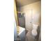 Small bathroom with a glass shower and a white sink and toilet at 3418 W Roma Ave, Phoenix, AZ 85017