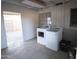A laundry room featuring a modern washer and dryer set with an adjacent outdoor view at 3418 W Roma Ave, Phoenix, AZ 85017