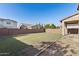 Expansive backyard with green grass, mature landscaping and a brick perimeter wall at 3556 E Austin Dr, Gilbert, AZ 85296