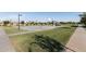 Community basketball court and grassy park area with shade trees for recreation at 3556 E Austin Dr, Gilbert, AZ 85296