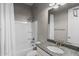 Cozy bathroom features granite vanity top, shower-tub, white tile, and modern faucet at 3556 E Austin Dr, Gilbert, AZ 85296