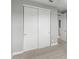 Bedroom with neutral carpet, gray walls, and white closet doors at 3556 E Austin Dr, Gilbert, AZ 85296