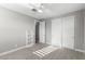 Bedroom features soft carpet, closet, ceiling fan and gray paint at 3556 E Austin Dr, Gilbert, AZ 85296