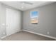Bedroom featuring soft carpet, neutral paint, closet with sliding door, and a window at 3556 E Austin Dr, Gilbert, AZ 85296