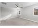 Light filled bedroom with plantation shutters, ceiling fan, and neutral carpeting at 3556 E Austin Dr, Gilbert, AZ 85296