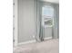 Bedroom with soft carpet and blue curtains that pair nicely with neutral paint at 3556 E Austin Dr, Gilbert, AZ 85296