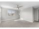Bright bedroom with natural light, ceiling fan, plantation shutters, and neutral carpet at 3556 E Austin Dr, Gilbert, AZ 85296