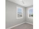 Bedroom featuring soft carpet, neutral paint and a window with stylish shutters at 3556 E Austin Dr, Gilbert, AZ 85296