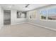 Spacious bedroom with plush carpet, ceiling fan and bright windows with stylish shutters at 3556 E Austin Dr, Gilbert, AZ 85296