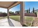 Covered patio overlooking the lush green backyard, ideal for outdoor entertaining at 3556 E Austin Dr, Gilbert, AZ 85296