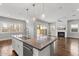 Modern kitchen island with granite countertops, stainless steel appliances, and pendant lighting at 3556 E Austin Dr, Gilbert, AZ 85296