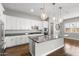 Stylish kitchen with granite countertops, stainless steel appliances, and modern globe pendant lighting at 3556 E Austin Dr, Gilbert, AZ 85296