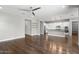 Spacious open-concept living area with hardwood floors leading to the kitchen and dining areas at 3556 E Austin Dr, Gilbert, AZ 85296