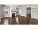 Spacious living room featuring dark wood floors, a fireplace, and recessed lighting at 3556 E Austin Dr, Gilbert, AZ 85296