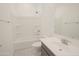 Bathroom featuring bathtub with shower, sink and tile flooring at 3611 E Archer Dr, San Tan Valley, AZ 85140
