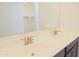 Bathroom featuring double sinks, modern faucets and white countertops at 3611 E Archer Dr, San Tan Valley, AZ 85140