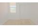 Bedroom featuring neutral carpet, window and closet at 3611 E Archer Dr, San Tan Valley, AZ 85140