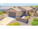 Charming single-story home featuring a two-car garage, desert landscaping, and stone accents on the facade at 3611 E Archer Dr, San Tan Valley, AZ 85140
