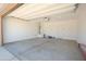 Clean two-car garage featuring ample space and a convenient interior door access at 3611 E Archer Dr, San Tan Valley, AZ 85140
