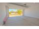 Spacious two-car garage with a concrete floor and an open door to the outside at 3611 E Archer Dr, San Tan Valley, AZ 85140