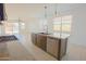 Bright, open-concept kitchen with stainless steel appliances and granite countertops at 3611 E Archer Dr, San Tan Valley, AZ 85140