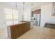 Modern kitchen with stainless steel appliances and a granite-topped island at 3611 E Archer Dr, San Tan Valley, AZ 85140