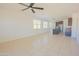 Open floor plan with tile flooring and multiple windows providing natural light into the living space at 3611 E Archer Dr, San Tan Valley, AZ 85140