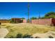 Wide shot of the backyard showcasing the block fence and potential outdoor living space at 3936 E Oak St, Phoenix, AZ 85006