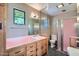 Bathroom featuring classic style cabinets, unique tiling, and a walk-in shower at 3936 E Oak St, Phoenix, AZ 85006