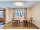 Cozy dining room featuring natural light from the window and a view into the kitchen at 3936 E Oak St, Phoenix, AZ 85006