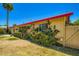 Exterior shot showing the side of the home, highlighting the lush landscaping at 3936 E Oak St, Phoenix, AZ 85006